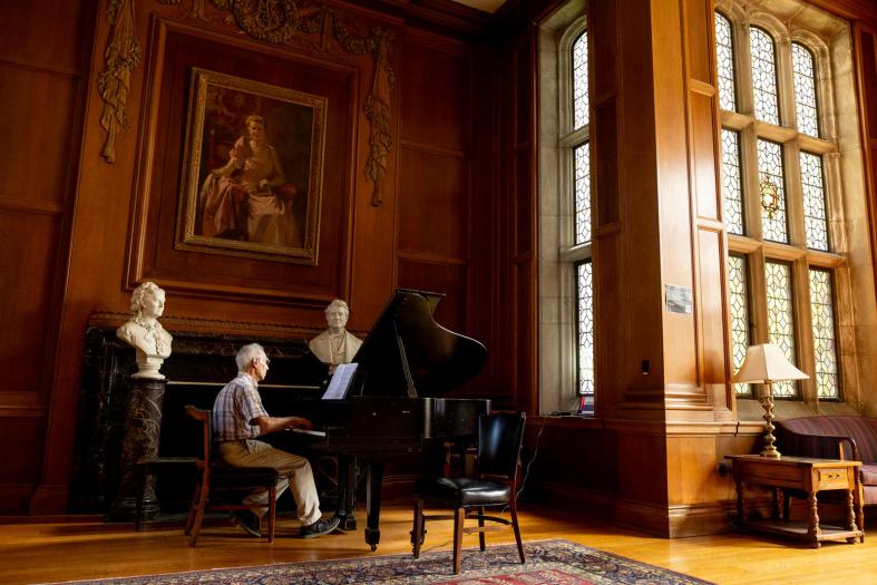 Piano inside lounge area of Anabel Taylor Chapel