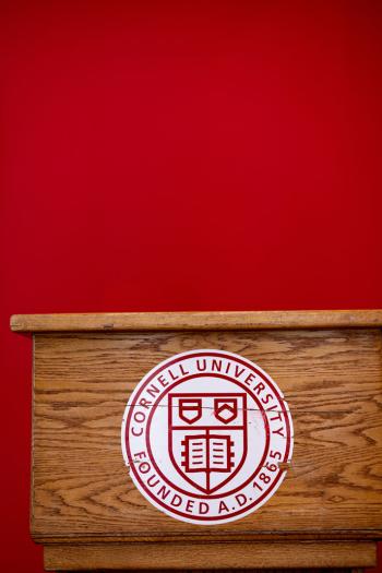 Podium with Cornell seal.