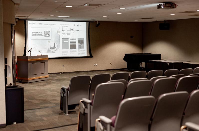 Robert Purcell Auditorium with theatre seating and a presentation screen.