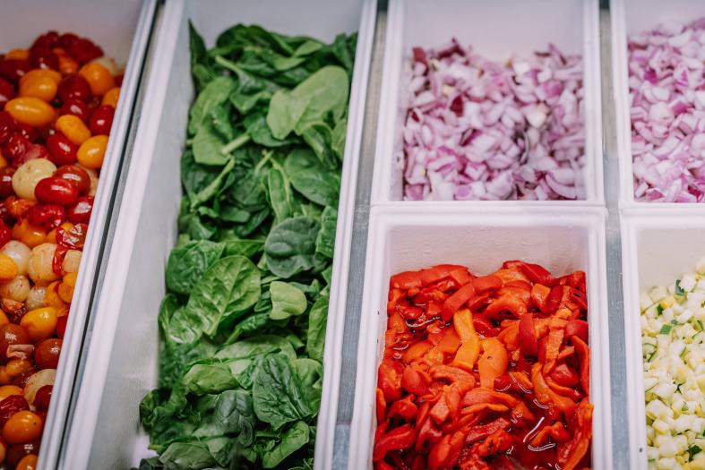 Salad bar with spinach, roasted red peppers, and so much more!
