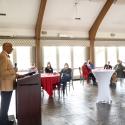 Speaker with small gathering at Moakley House